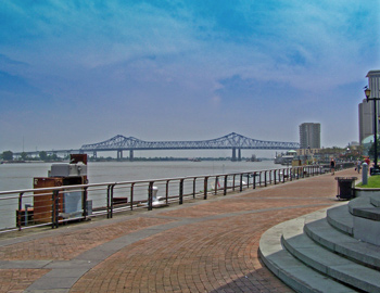 New Orleans curves around the bank of the Mississippi River like a smile.